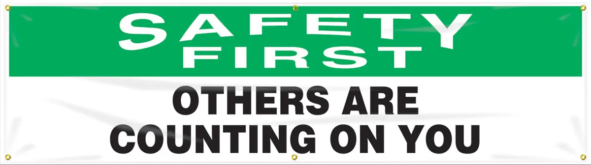 Accuform® 4" X 96" Green, Black And White Reinforced Flexible Poly Sheeting Safety Banners & Posters "SAFETY FIRST OTHER ARE COUNTING ON YOU"
