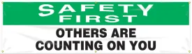 Accuform® 4" X 96" Green, Black And White Reinforced Flexible Poly Sheeting Safety Banners & Posters "SAFETY FIRST OTHER ARE COUNTING ON YOU"